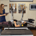 spinal decompression vs traction chiropractor patient on table